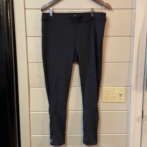 Athleta Leggings in Black with Back Zip Pocket and Ankle Zippers Size L.